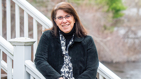 Elizabeth Englander standing on steps outdoors