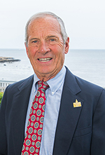 Headshot of John &quot;Jack&quot; Jones wearing a suit and tie.