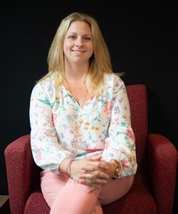 Jennifer Currie sitting on a chair