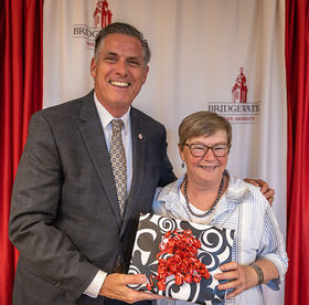 Retiring Dean of Undergraduate Studies Rita Miller poses with BSU president Fred Clark at an appreciation luncheon
