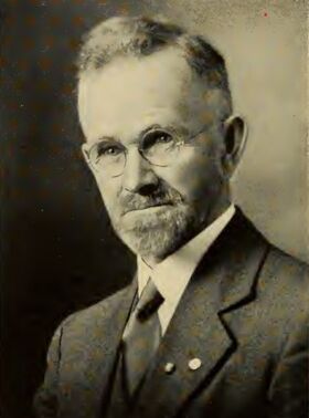Black-and-white headshot of Louis Stearns