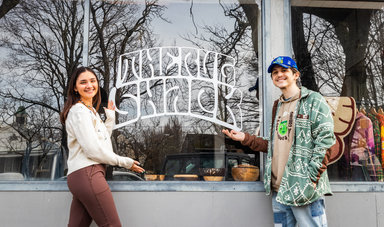 Matt Turner, '19 and Megan Belmonte, '22 stand in front of their new Rug Shack shop