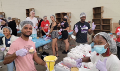 BSU volunteers pack up boxes of food for those in need