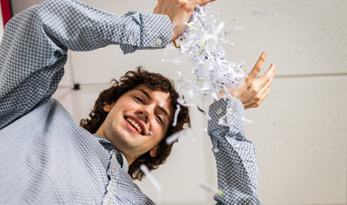 Cameron Cruzen thows away paper