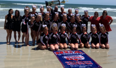 BSU Cheer Team celebrates on beach