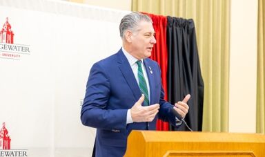 Peter Koutoujian speaks from a podium.