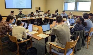 Students work together on editing resumes.