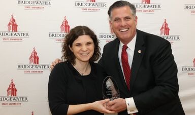 Caroline Stanley receives an award from President Clark.