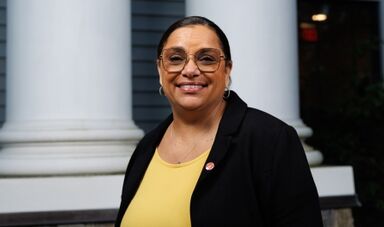 Ann Ulett stands in front of white columns.