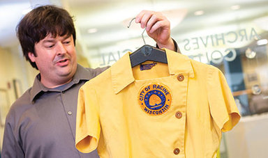 Curator holds uniform