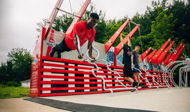 Two students working out on the fitness court
