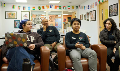 Anthony Tabbi and three students having a discussion in the LGCIE office