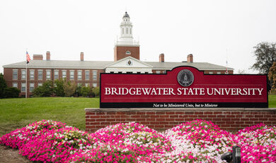 Bridgewater State University sign in front of a building with a cupola 