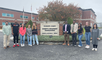 Members of the BSUPD Building Bridges program stand outside of the Plymouth County Correctional facility 