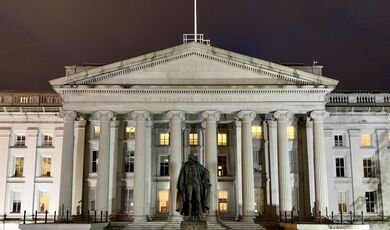 The Treasury Building in Washington, D.C., with the statue of Albert Gallatin in the foreground.