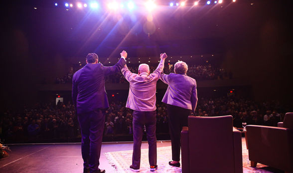 Fred Clark, President of BSU, Lech Walesa, former President of Poland and Dr Jean Macormack, Board of Trustee raise hands at end of speaking engagement.