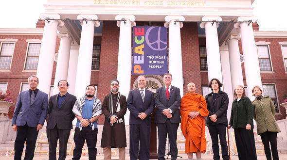 Campus and community leaders stand united at a rally for peace held on the Boyden quad