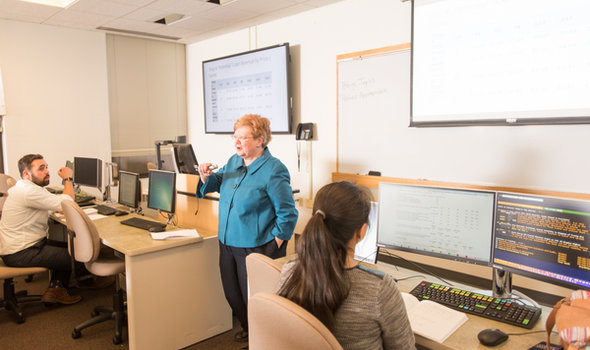 Dr. Marian Extjet teaching a Management class