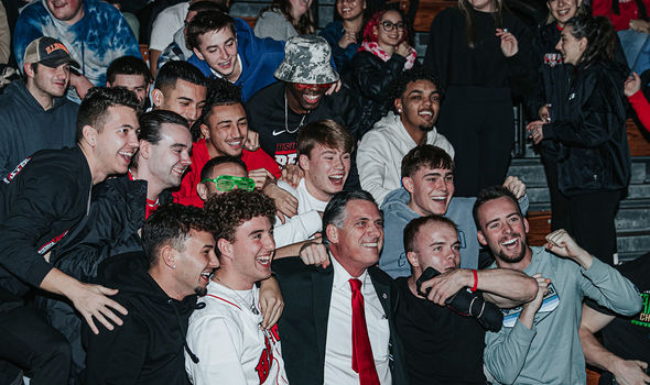 A crowd of students pose with BSU president Fred Clark at Midnight Madness