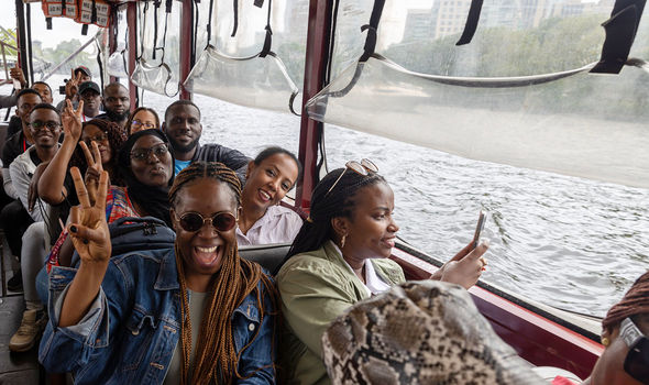 Mandela Washington Fellows smile and pose while on a duck boat tour of the Charles River