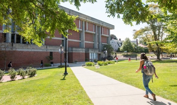 students in courtyard next to Maxwell Library