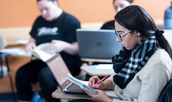 Student at desk with laptop
