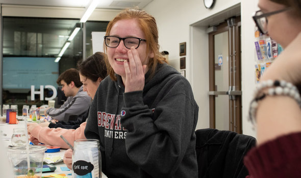 students creating wellness jars with one titled Self Care in the foreground