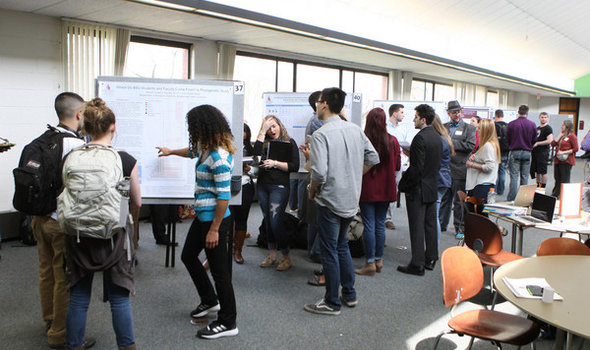 BSU research symposium with students presenting posters on their research