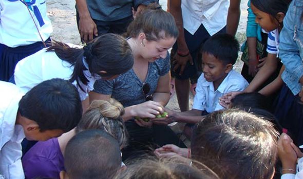 Student works overseas with children