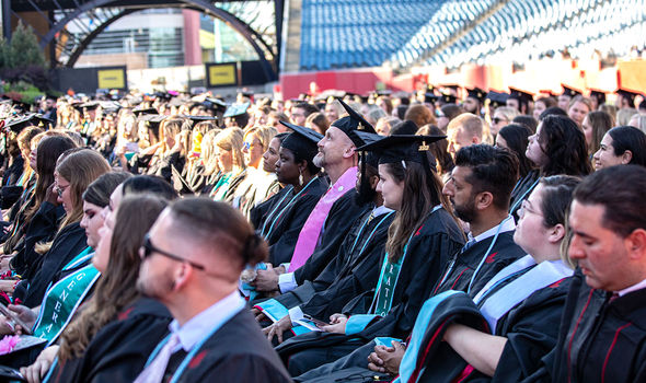 A BSU employee among fellow masters degree graduates