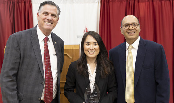 Dr. Inkyoung Kim smiling with BSU President Fred Clark and BSU Provost Karim Ismali at the Academic Excellence Awards