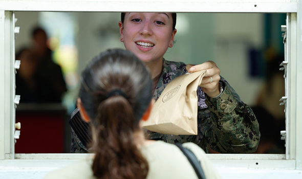 Photo By: Navy Chief Petty Officer Mark Logico, courtesy of the Department of Defense: Navy Petty Officer 3rd Class Rachel Lantz dispenses prescription medicine to a patient in a temporary medical facility at the port of Limón, Costa Rica, July 19, 2024, during Continuing Promise.