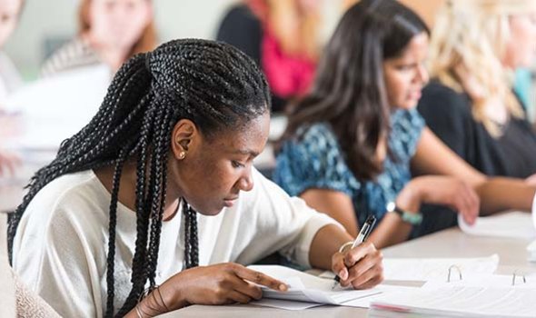 Students take notes in class