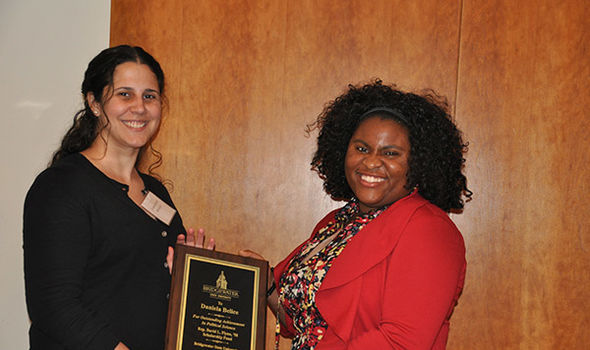 Dr. Rachel Navarre and student Daniela Belice showing Daniela's award received at the BSU MPA dinner
