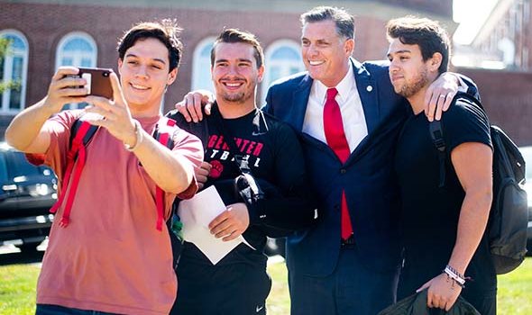 President Clark stops to take a selfie with eager students