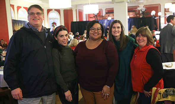 Five BSU employees smiling for the camera at the faculty holiday party