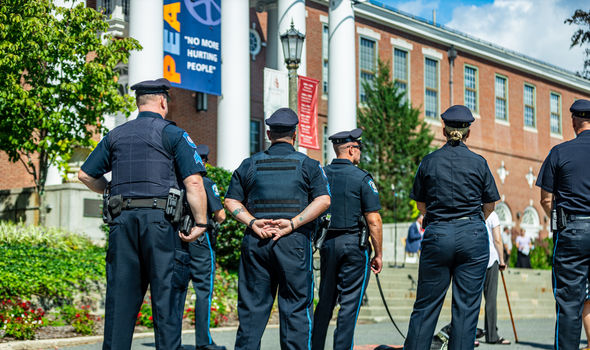 The backs of BSU police officers during an event at Boyden Hall