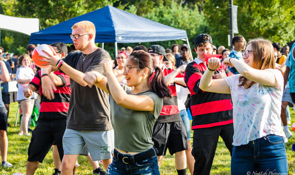 a group of students  dancing at the Welcome Back BBQ