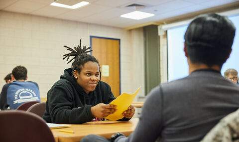 Students at a desk in an English classroom