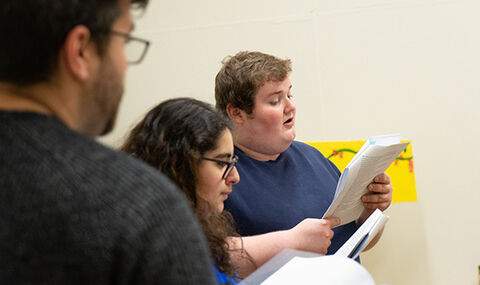 3 BSU theatre students reading lines from a script