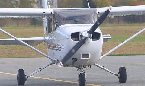Front view of a BSU airplane taxiing 