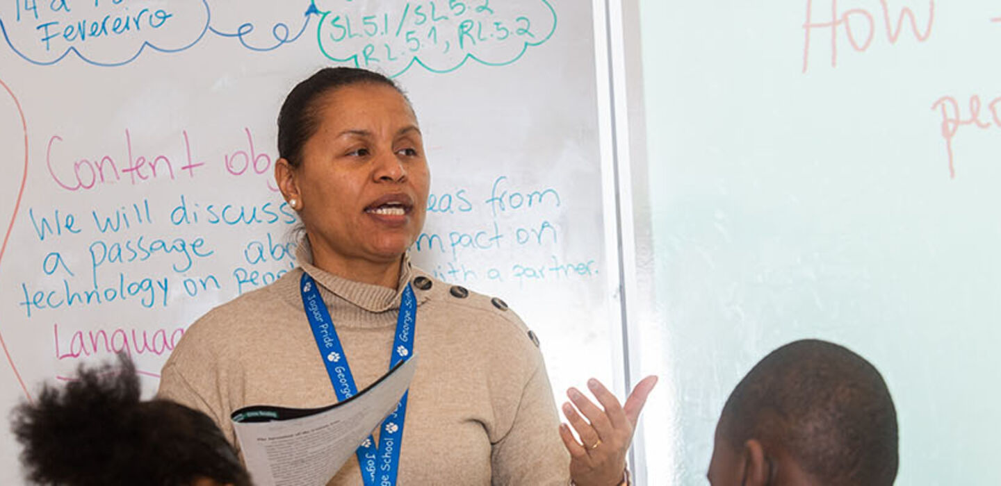 BSU TESOL student teacher teaching in front of a white board